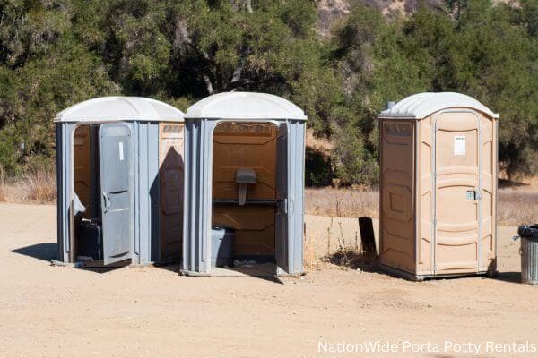 a clean row of portable restrooms for outdoor weddings or festivals in Erick, OK